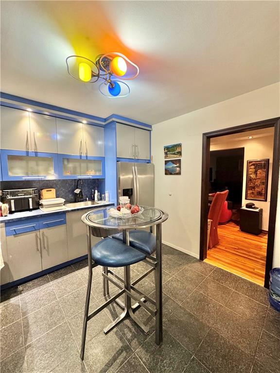 3105 Ave V, Unit 2E Brooklyn, NY 11229 - Photo 5 of 9 a kitchen with a table and chairs in it