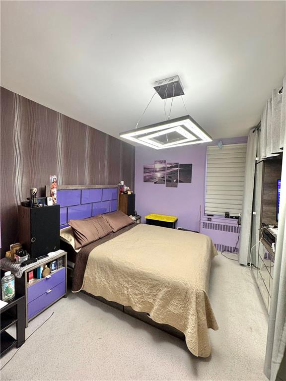 3105 Ave V, Unit 2E Brooklyn, NY 11229 - Photo 9 of 9 a bedroom with a bed and a tv