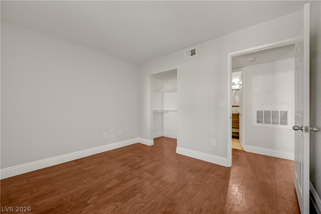 7885 West Flamingo Road, Unit 1050 Las Vegas, NV 89147 - Photo 29 of 62 Rich hardwood floors create a welcoming atmosphere in this adaptable space.