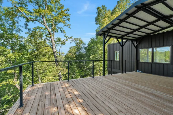 a view of a balcony with wooden floor