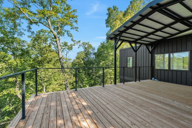 a view of a balcony with wooden floor