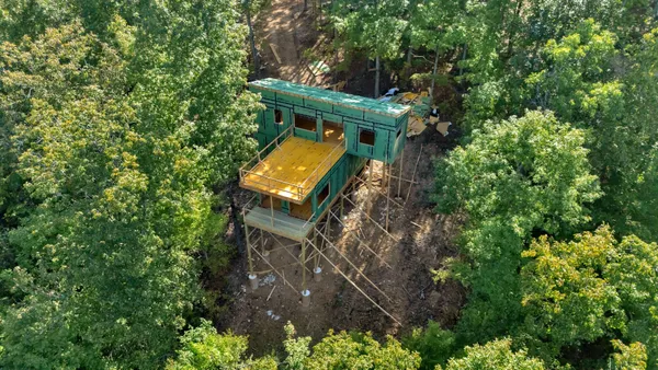 front view of a house with a yard
