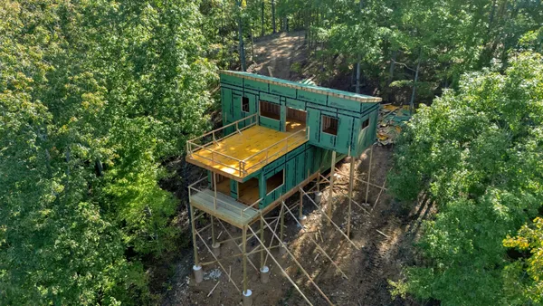 an aerial view of house with yard
