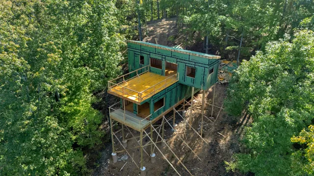 an aerial view of house with yard