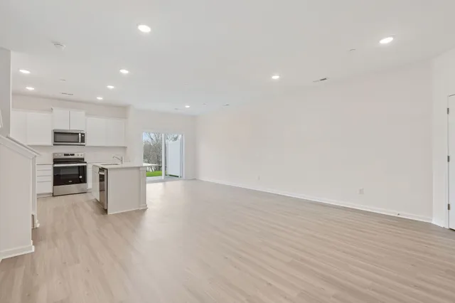 a view of kitchen with wooden floor