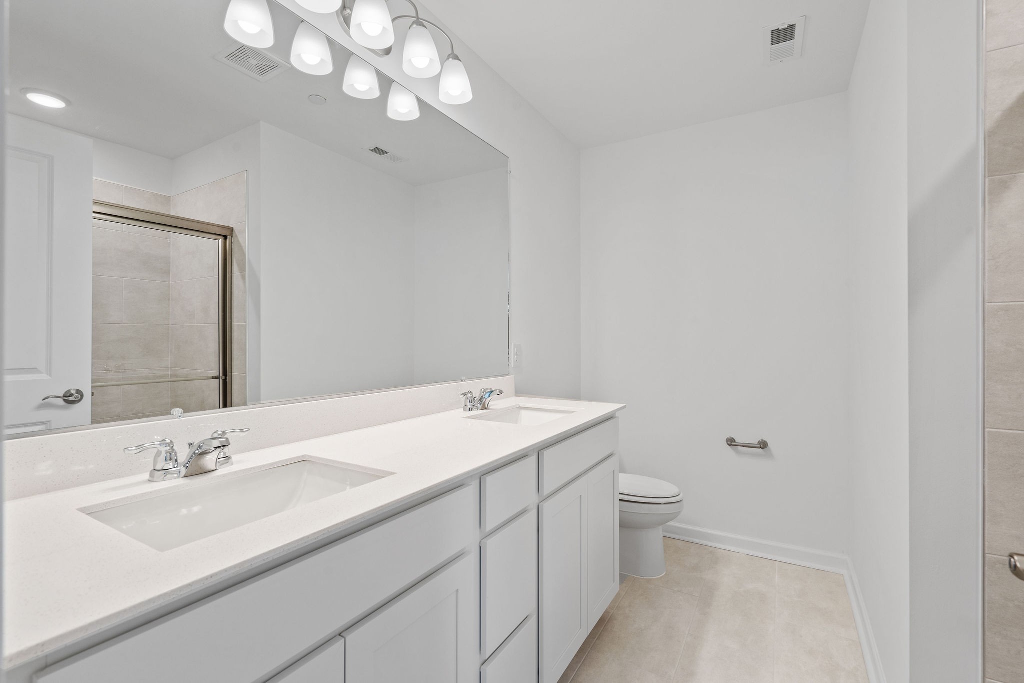 7124 Mapleside Lane Fairview, TN 37062 - Photo 25 of 30 a bathroom with a sink a toilet and a mirror