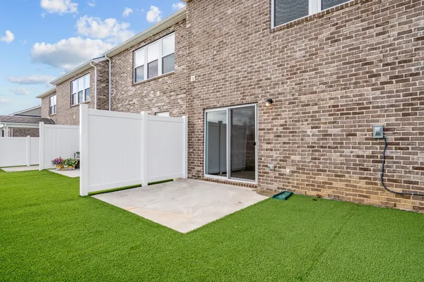 a view of a swimming pool with an outdoor space and seating area