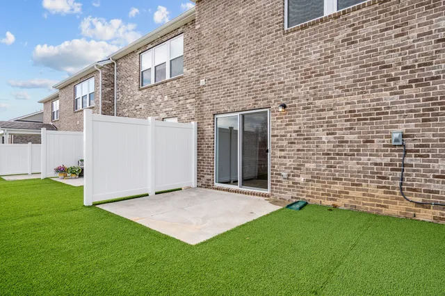 a view of a swimming pool with an outdoor space and seating area