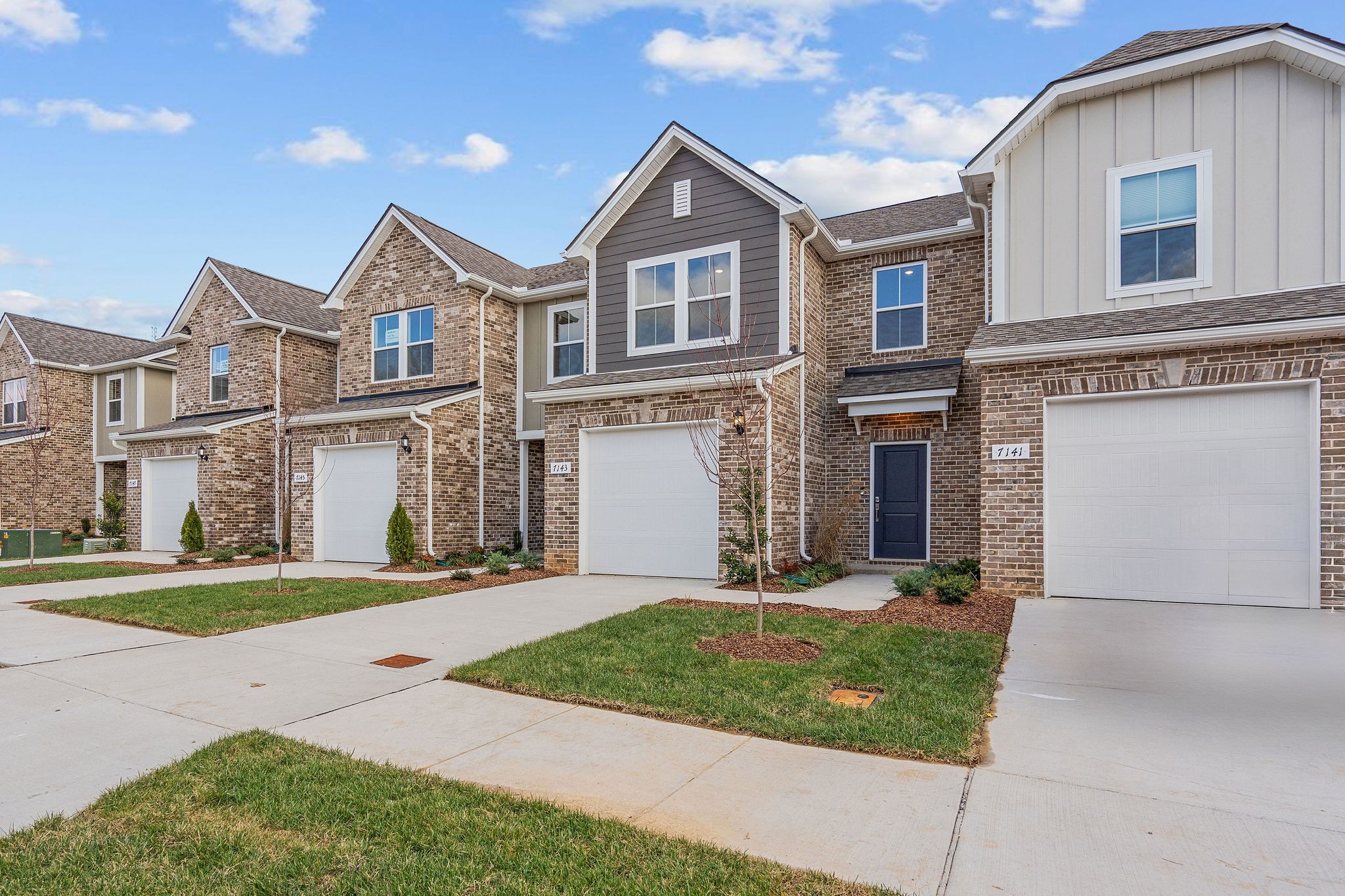 7124 Mapleside Lane Fairview, TN 37062 - Photo 3 of 30 a front view of a house with a yard and garage