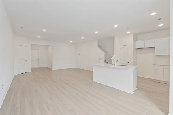 a view of kitchen with center island stainless steel appliances and cabinets