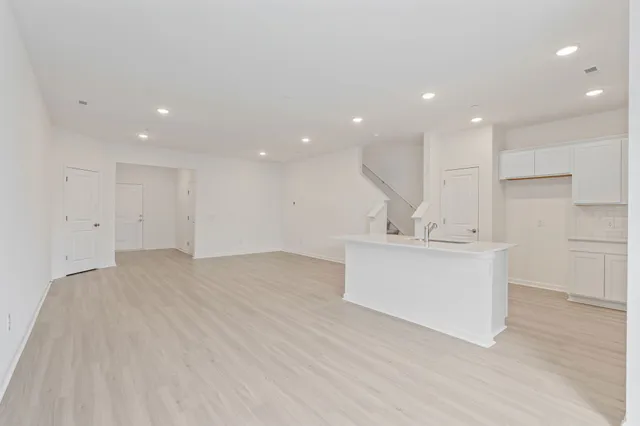 a view of kitchen with center island stainless steel appliances and cabinets
