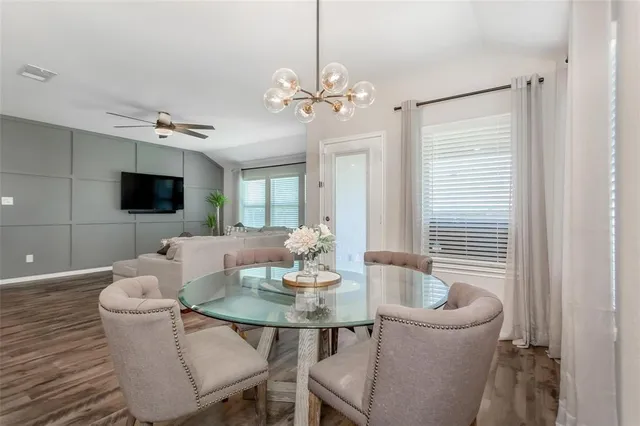 a dining room with furniture and window