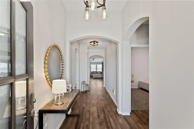 a view of living room with wooden floor and furniture