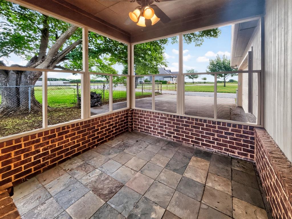 1255 Vineyard Road Gunter, TX 75058 - Photo 3 of 20 a view of a porch with wooden floor
