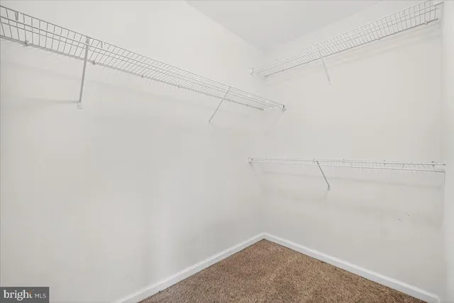 a view of a room with racks on the wall