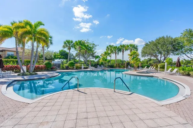 a view of a swimming pool and a patio