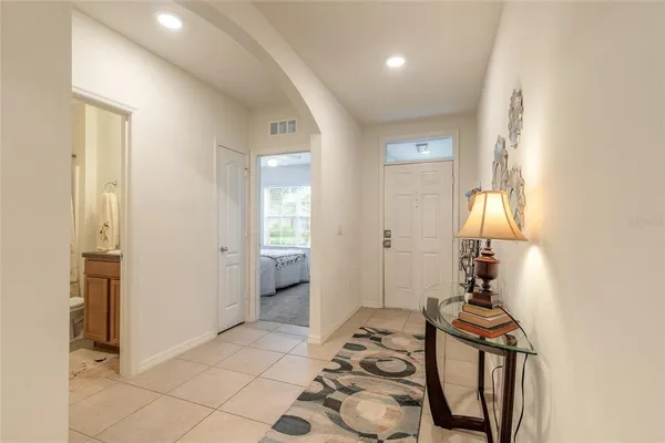 a view of a bedroom with a bed and glass door