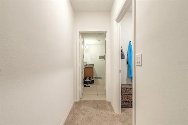 a bathroom with a granite countertop toilet and a sink