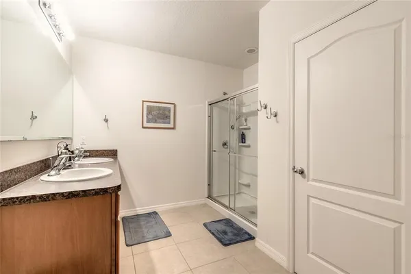 a bathroom with a shower and a sink