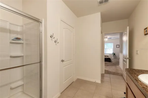 a bedroom with furniture and a large window