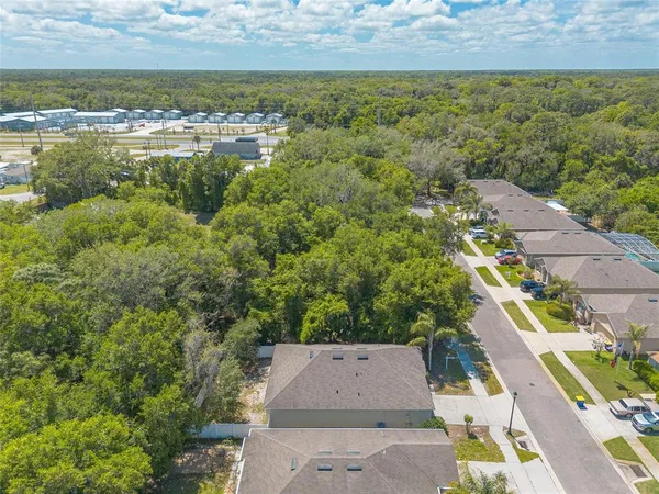 an aerial view of residential house with outdoor space