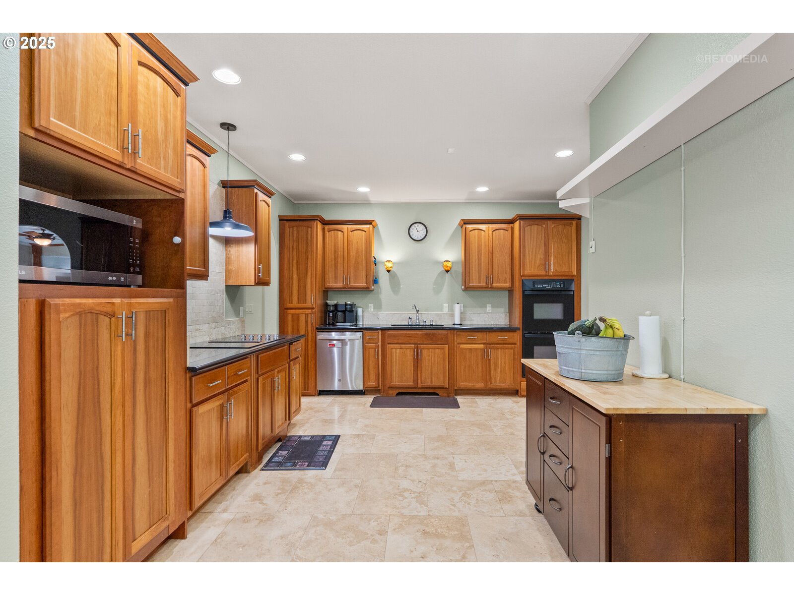 40811 Northwest Linklater Road North Plains, OR 97133 - Photo 12 of 48 a kitchen with stainless steel appliances kitchen island granite countertop a sink and cabinets