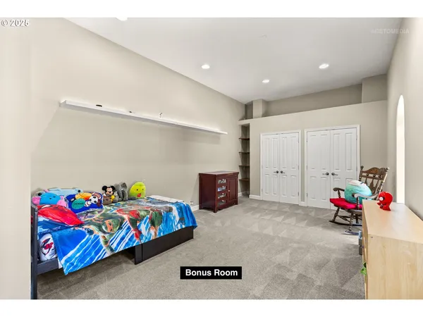 a bedroom with furniture and a potted plant