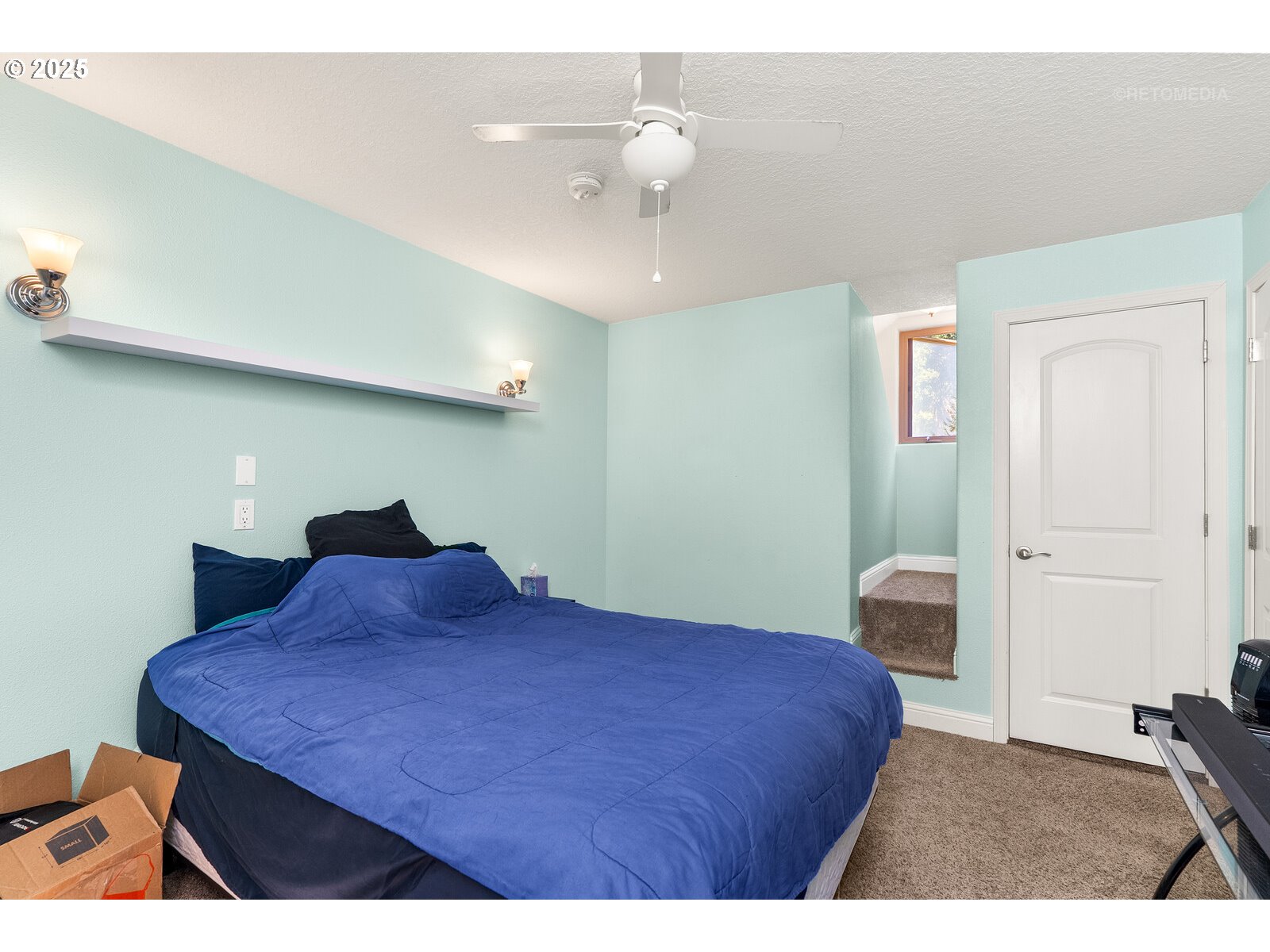 40811 Northwest Linklater Road North Plains, OR 97133 - Photo 28 of 48 a bedroom with a bed and a chandelier