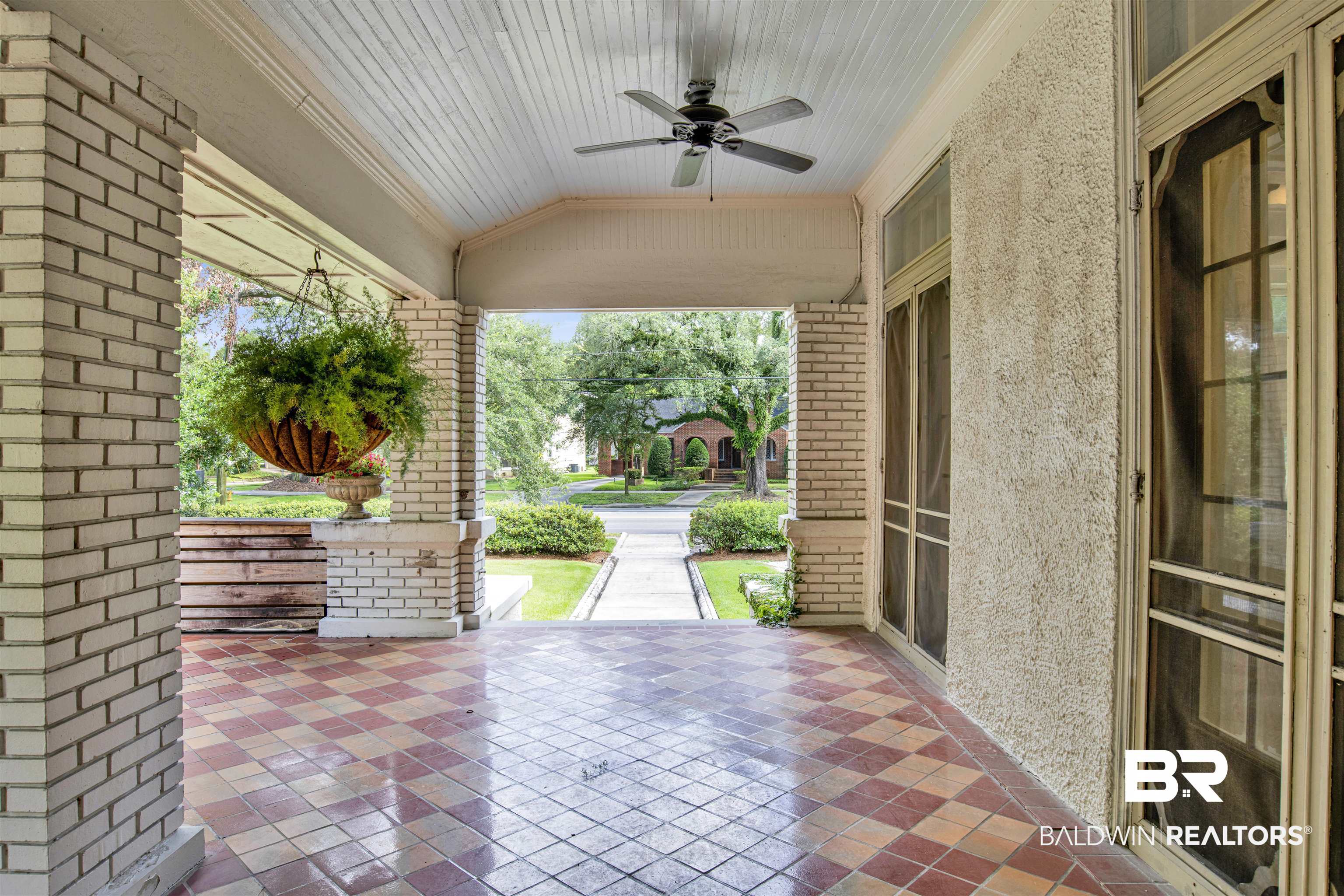 1654 Government Street Mobile, AL 36604 - Photo 7 of 45 View of patio featuring ceiling fan and covered porch