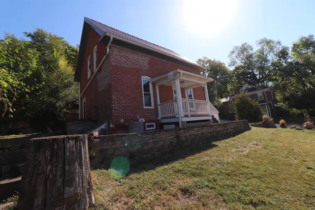 a view of a backyard with trees