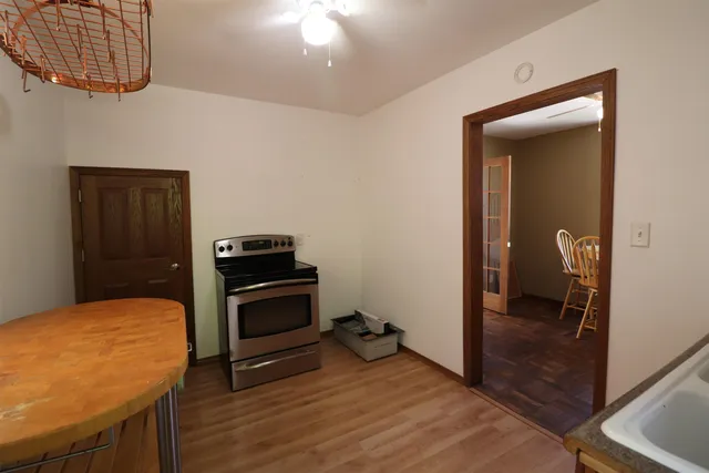 a view of a kitchen from the hallway