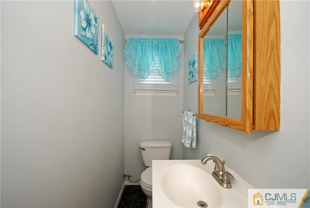 25 Barlow Road Edison, NJ 08817 - Photo 13 of 27 a bathroom with sink and mirror