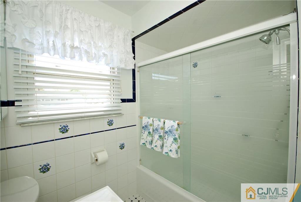25 Barlow Road Edison, NJ 08817 - Photo 18 of 27 a bathroom with a shower and a sink