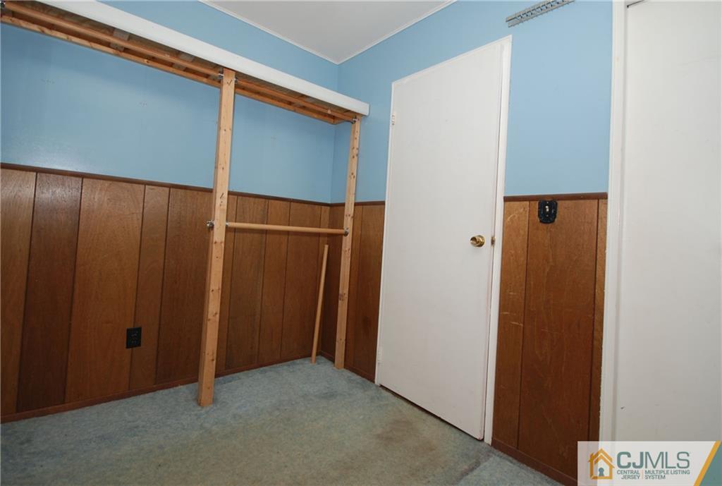 25 Barlow Road Edison, NJ 08817 - Photo 20 of 27 an empty room with an entryway door