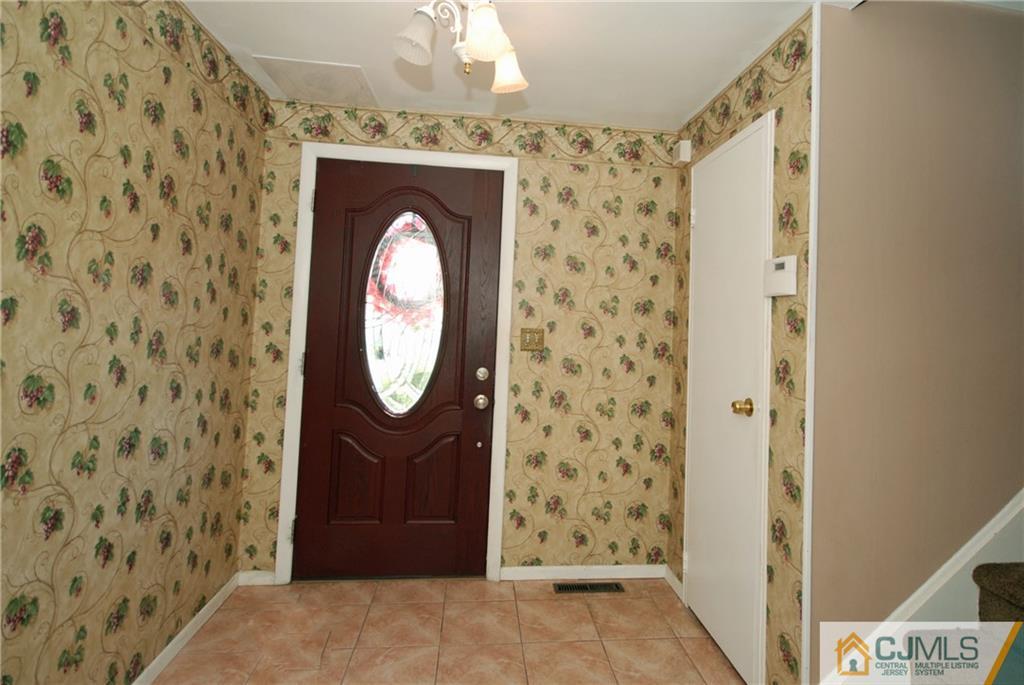 25 Barlow Road Edison, NJ 08817 - Photo 2 of 27 a front view of a house with entryway