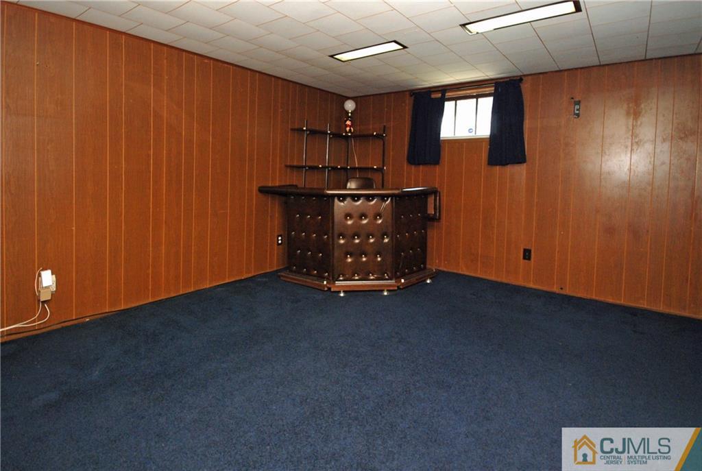 25 Barlow Road Edison, NJ 08817 - Photo 22 of 27 a view of an empty room with window and a kitchen
