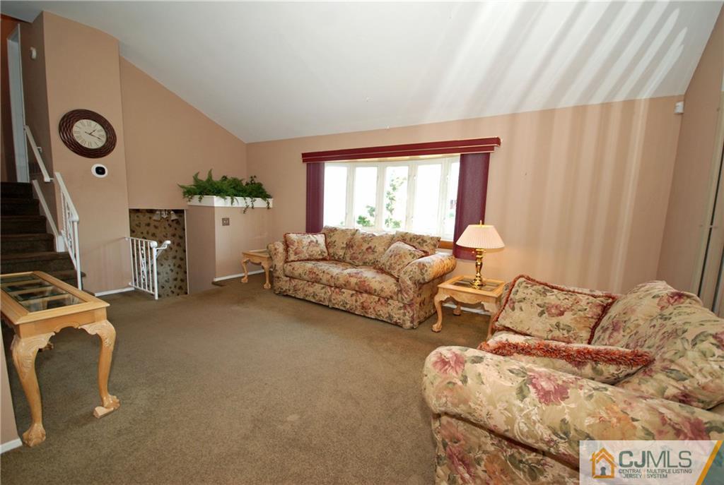 25 Barlow Road Edison, NJ 08817 - Photo 3 of 27 a living room with furniture and a window