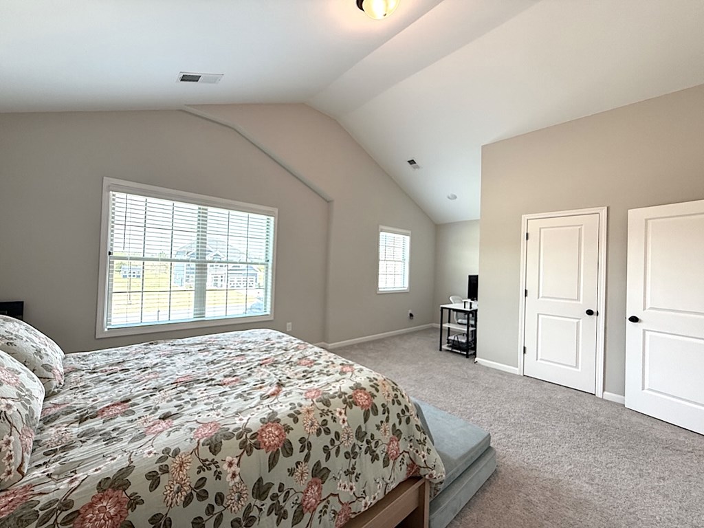 33 Sugar Maple Drive Fort Mitchell, AL 36856 - Photo 25 of 29 a bedroom with a large bed and a window