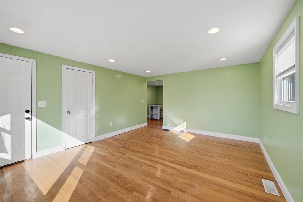 30 Lively Lane Springfield, MA 01109 - Photo 11 of 33 a big room with wooden floor and windows