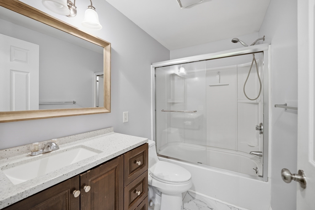 30 Lively Lane Springfield, MA 01109 - Photo 17 of 33 a bathroom with a sink a toilet and shower