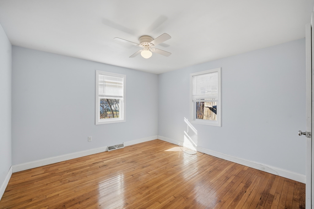 30 Lively Lane Springfield, MA 01109 - Photo 18 of 33 a view of empty room with wooden floor and fan