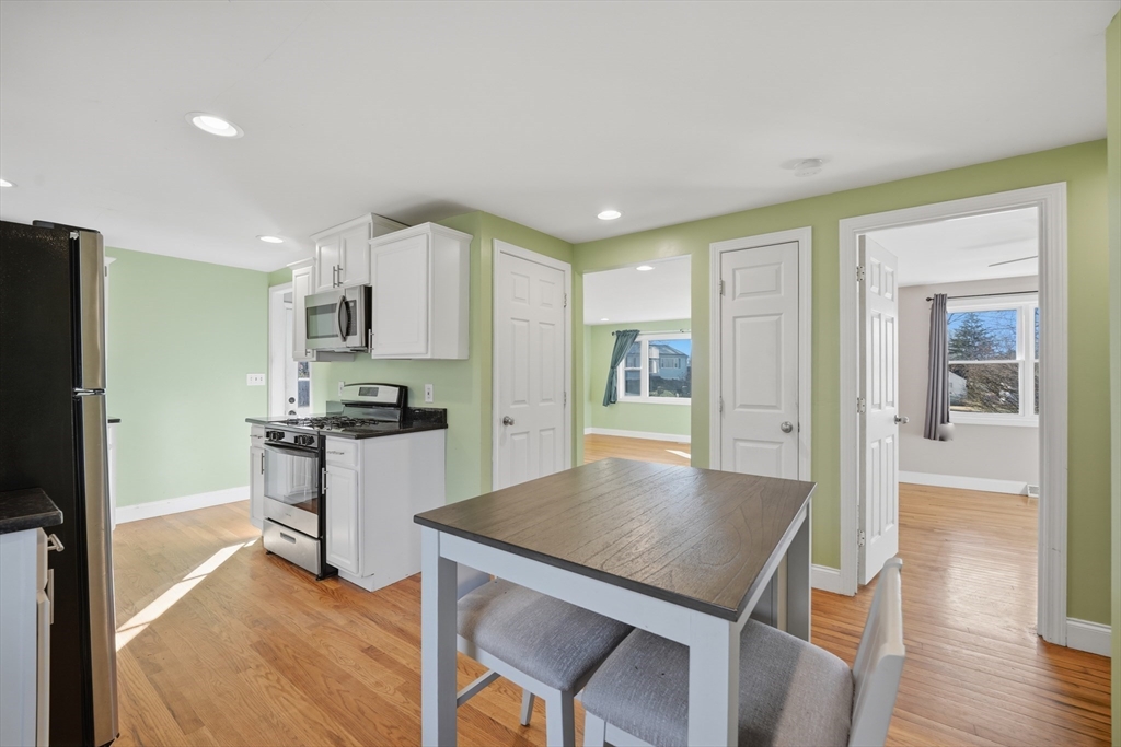 30 Lively Lane Springfield, MA 01109 - Photo 8 of 33 a kitchen with a table and chairs in it