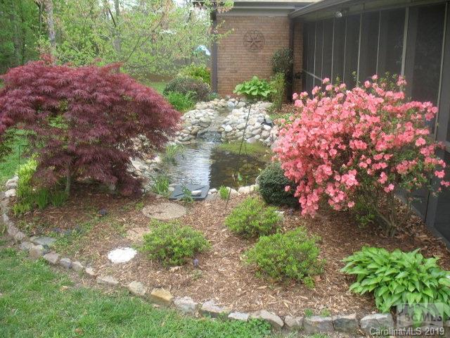 103 Ervindale Lane Morganton, NC 28655 - Photo 4 of 13 a bunch of flowers are in a garden