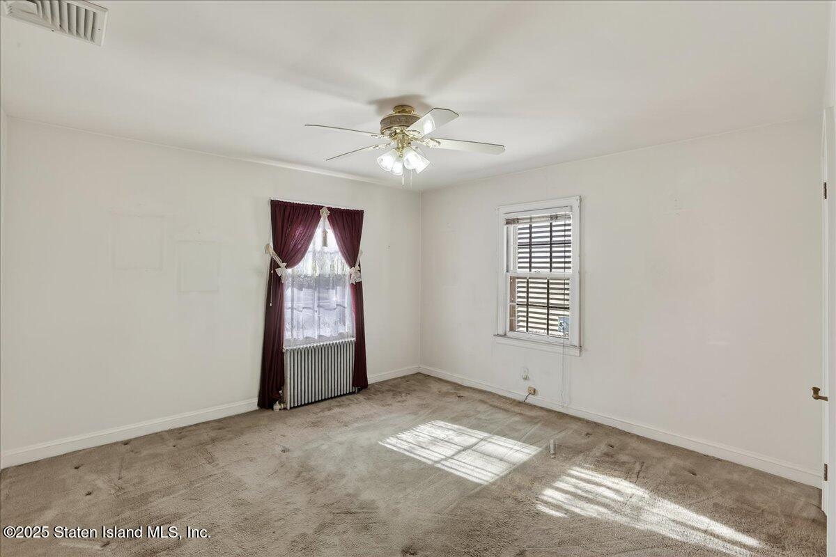 35 Crowell Avenue Staten Island, NY 10314 - Photo 11 of 33 a view of an empty room with window and chandelier fan