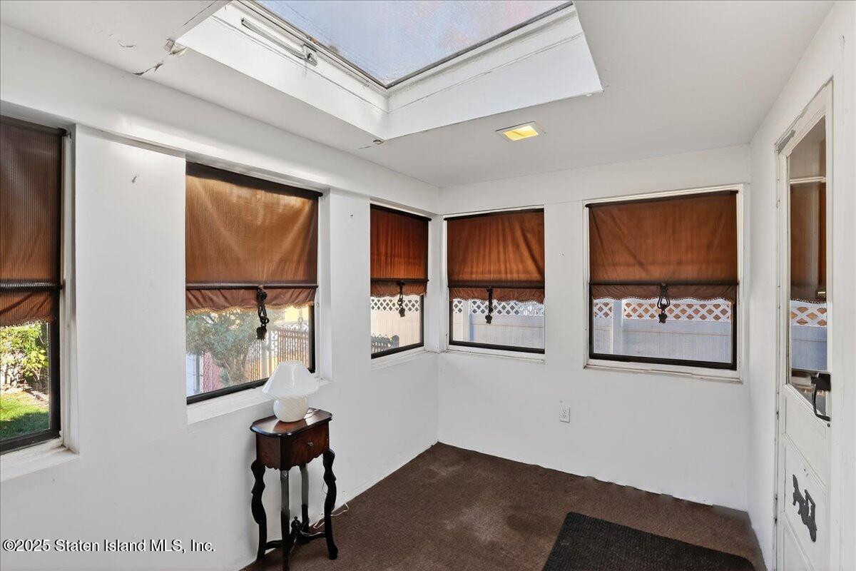 35 Crowell Avenue Staten Island, NY 10314 - Photo 23 of 33 a view of a hallway with furniture and windows