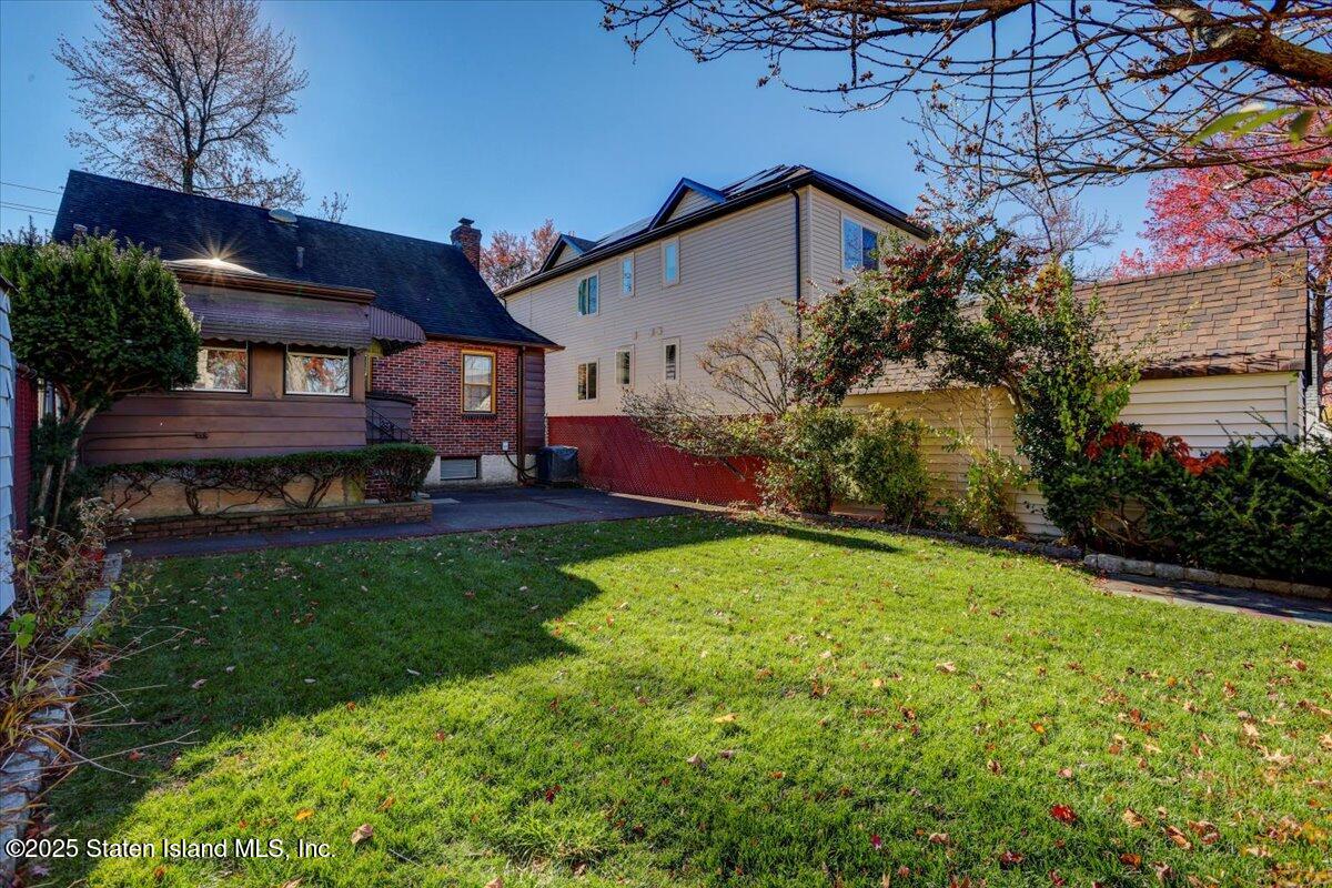 35 Crowell Avenue Staten Island, NY 10314 - Photo 26 of 33 a view of a house with a big yard potted plants and large tree