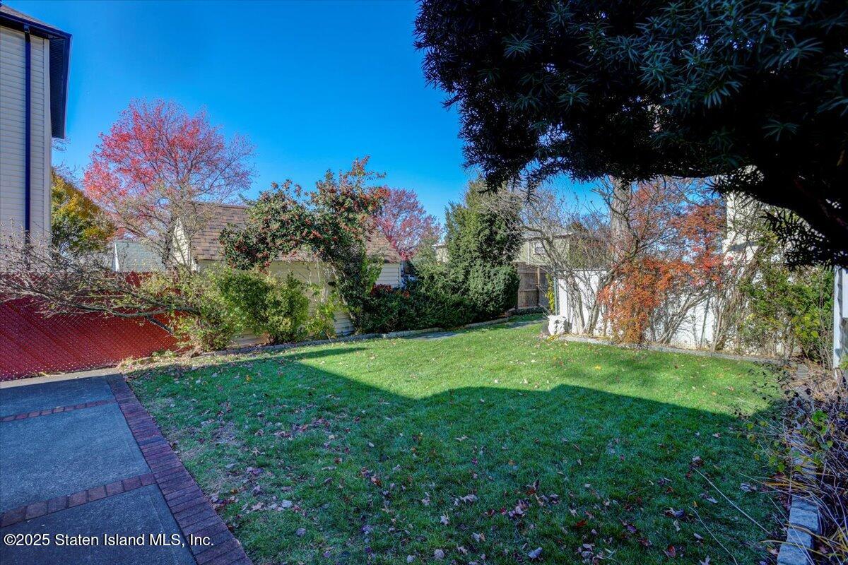 35 Crowell Avenue Staten Island, NY 10314 - Photo 29 of 33 a view of a yard with a tree