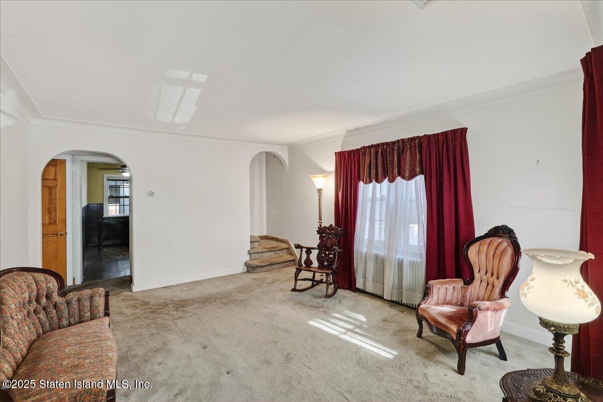 35 Crowell Avenue Staten Island, NY 10314 - Photo 5 of 33 a living room with furniture and a chair