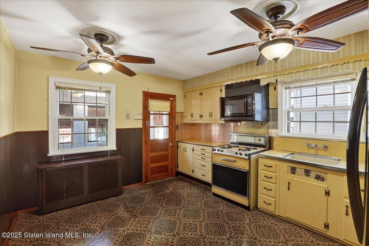 35 Crowell Avenue Staten Island, NY 10314 - Photo 9 of 33 a kitchen with stainless steel appliances granite countertop a stove cabinets and a refrigerator