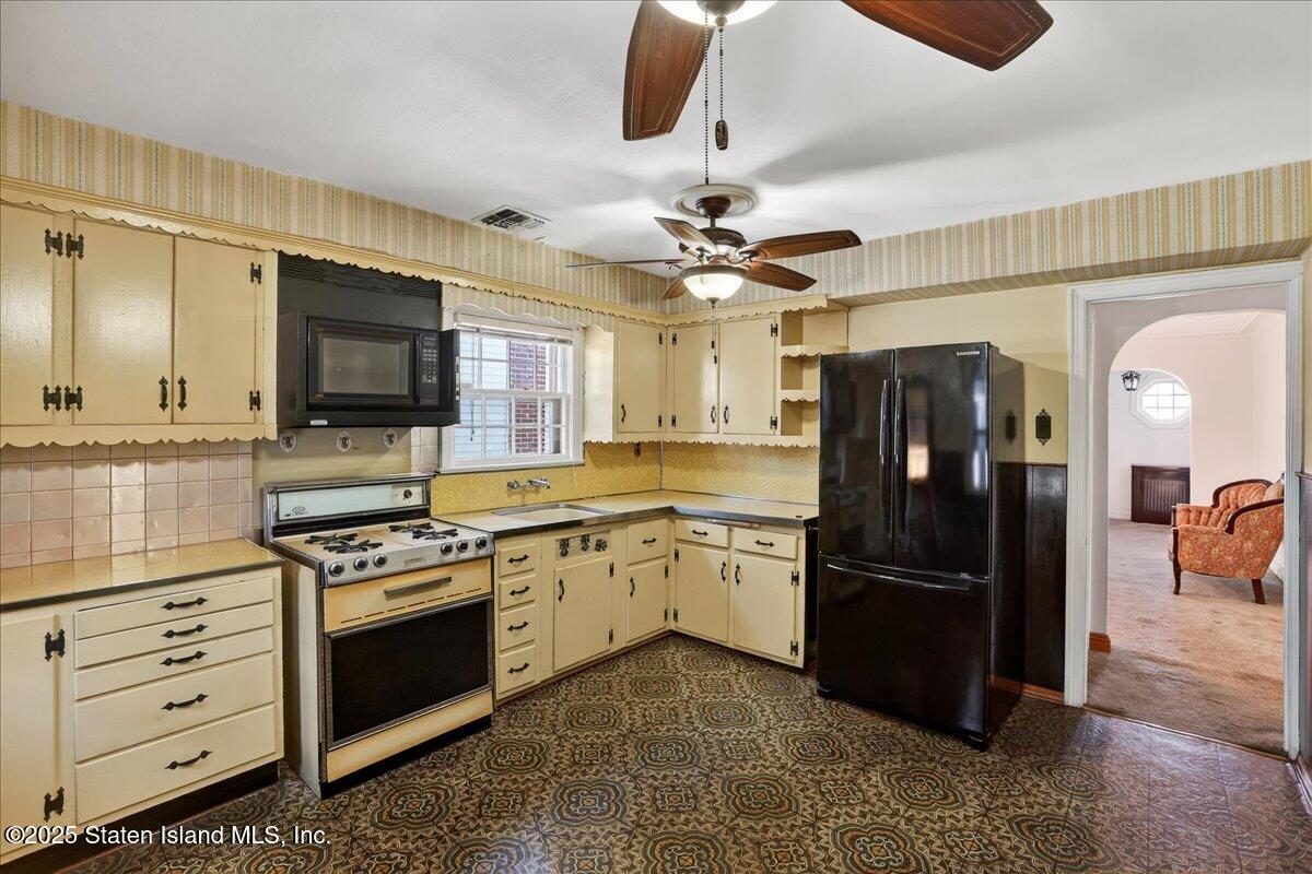 35 Crowell Avenue Staten Island, NY 10314 - Photo 10 of 33 a kitchen with stainless steel appliances granite countertop a refrigerator a stove and a sink